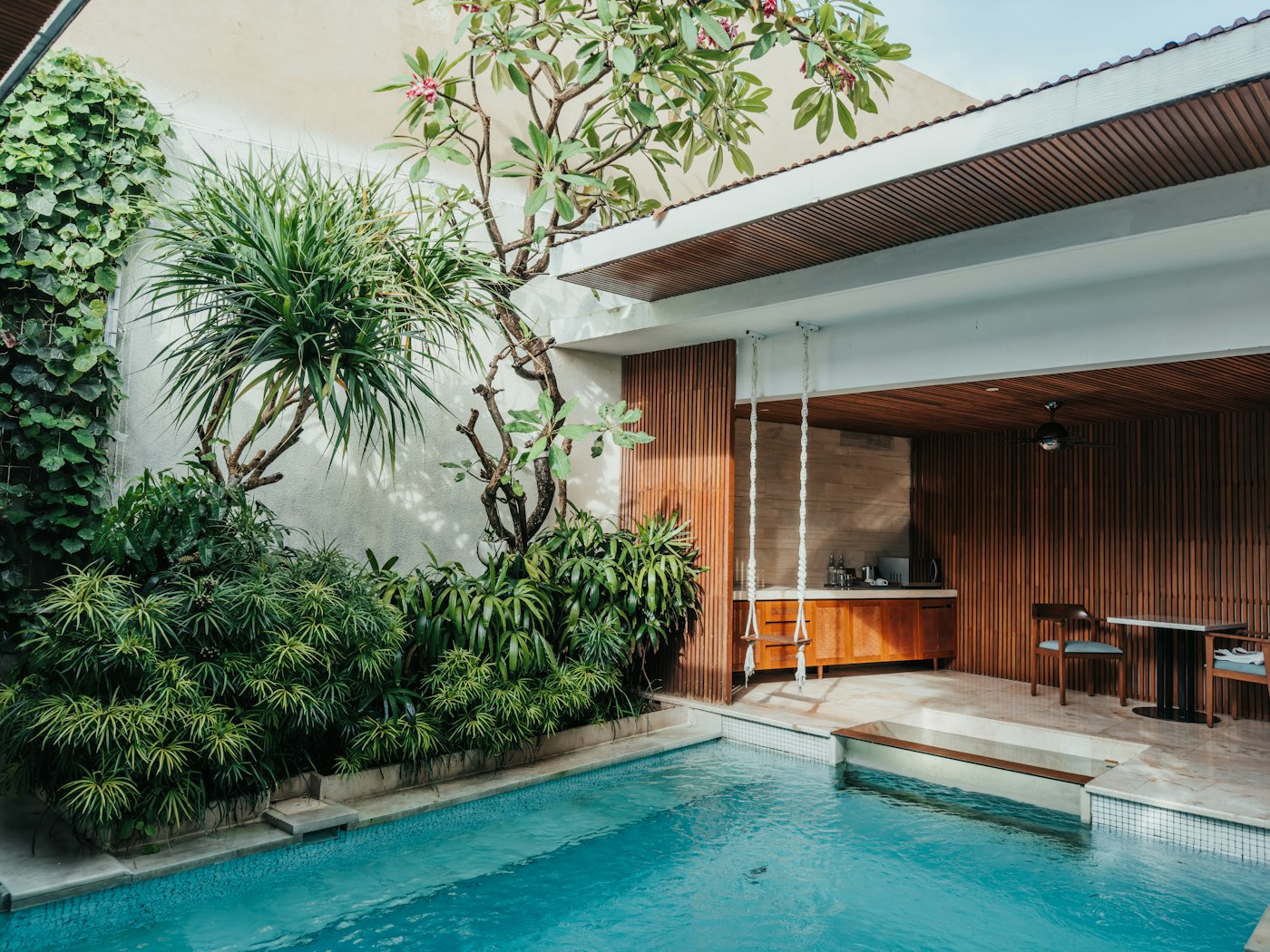 Tropical holiday pool surrounded by lush greenery in Bali