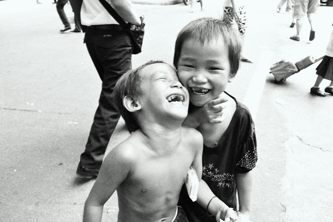 Two young children standing together