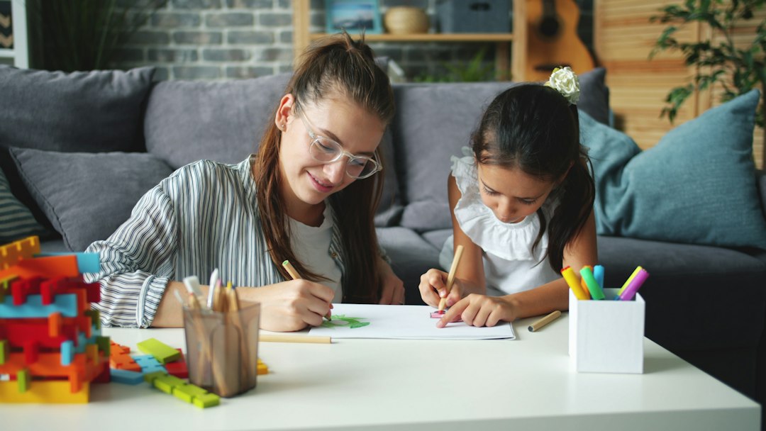 A child drawing with a parent during creative play