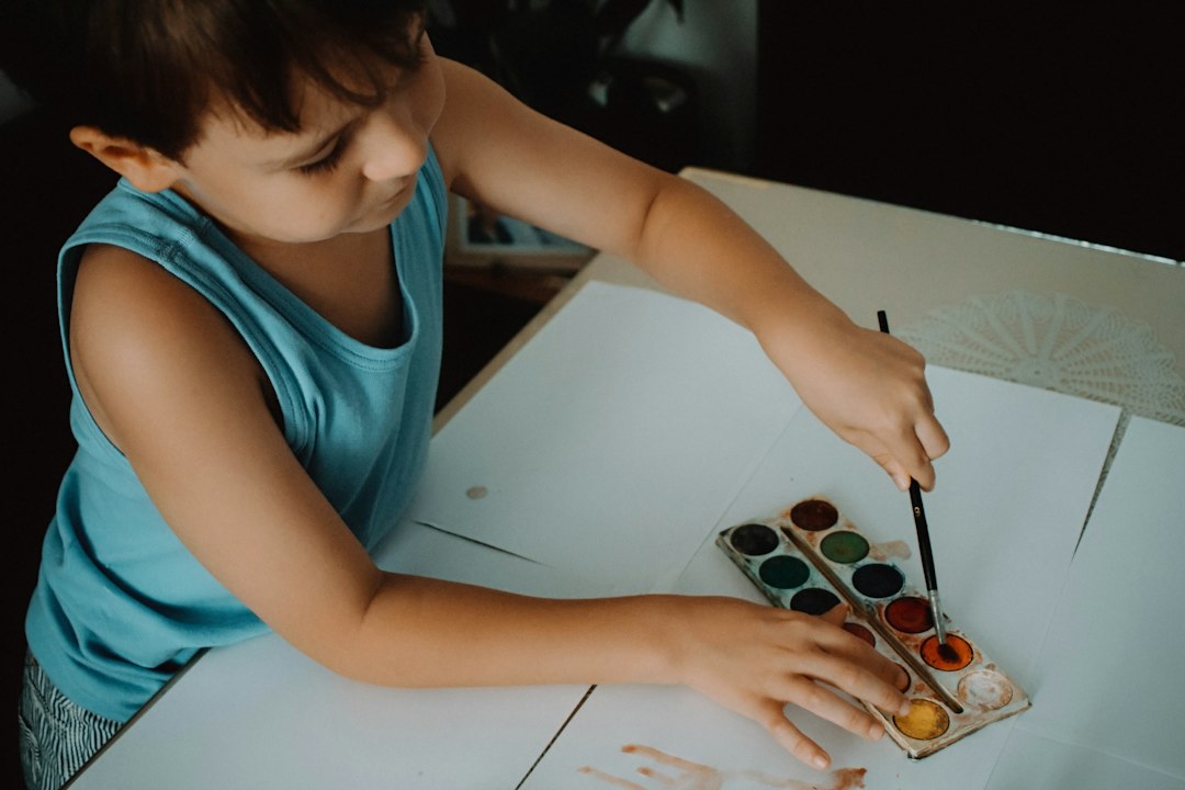 Child making a colorful painting