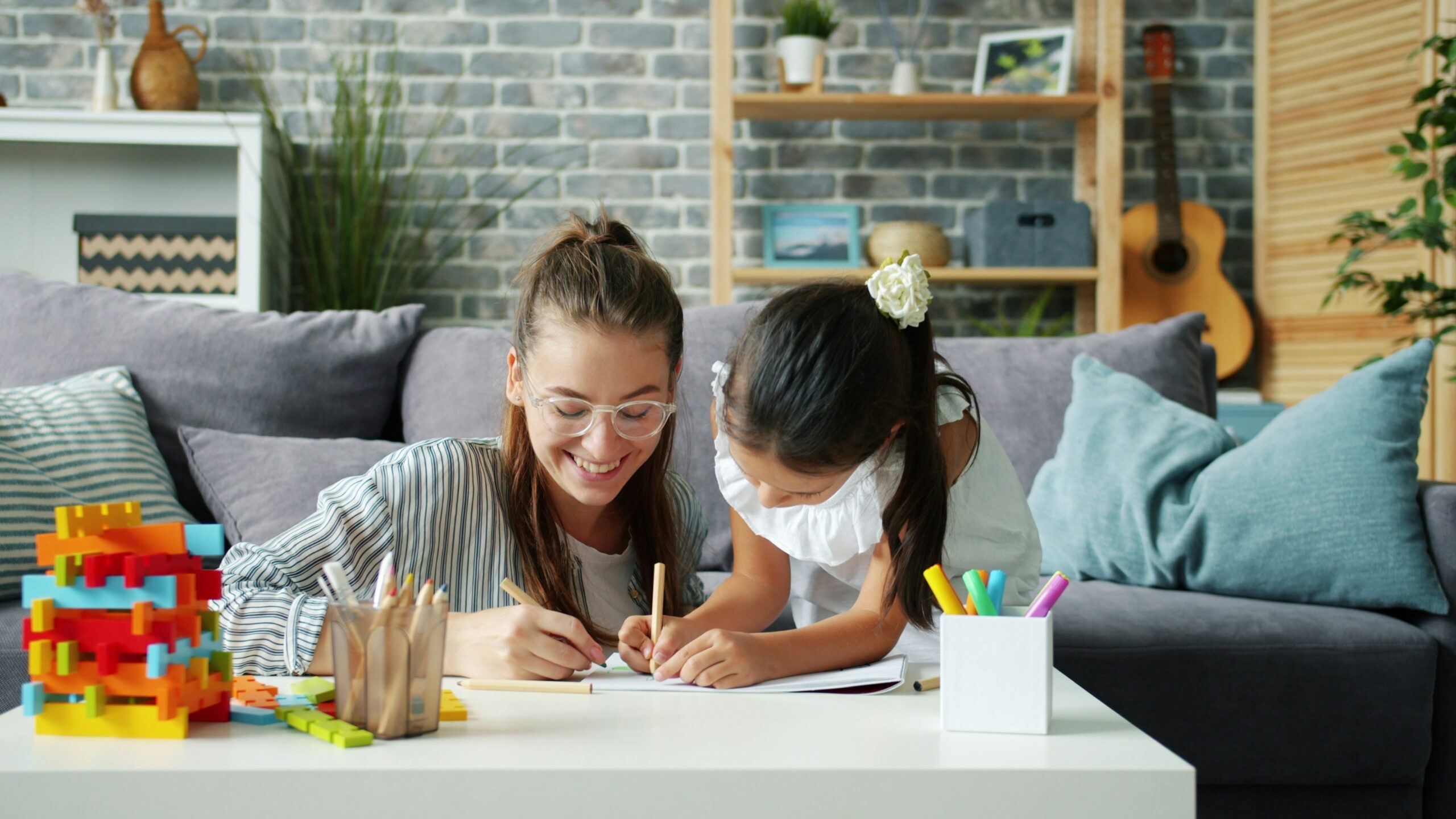 Child drawing and creating during a hands-on creative learning activity