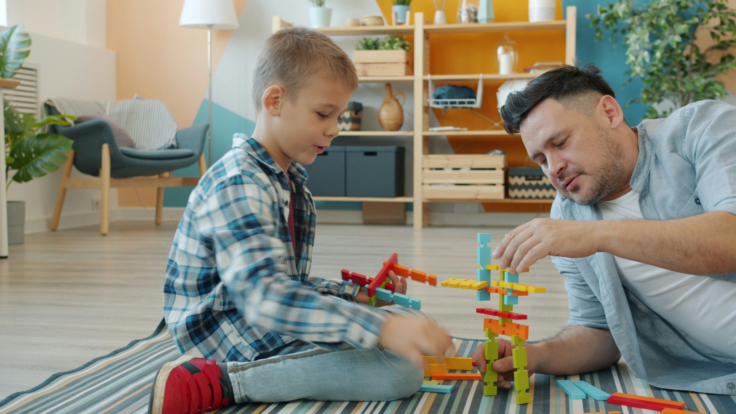 Child and parent learning together through a building and STEM activity