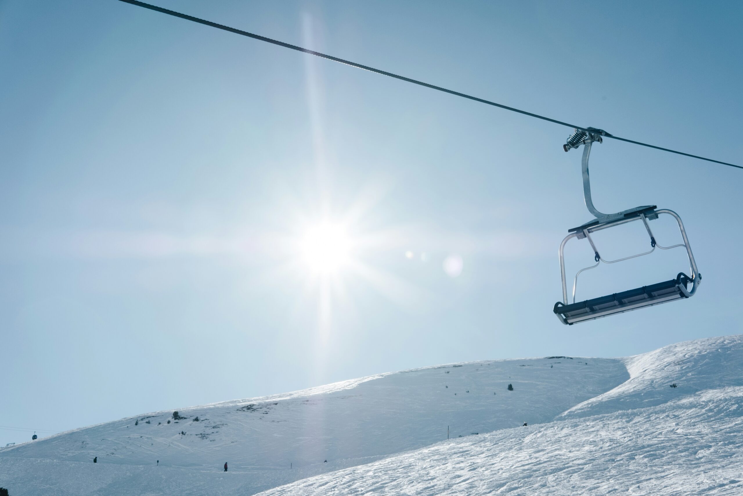 Skier on a snowy mountain piste during winter