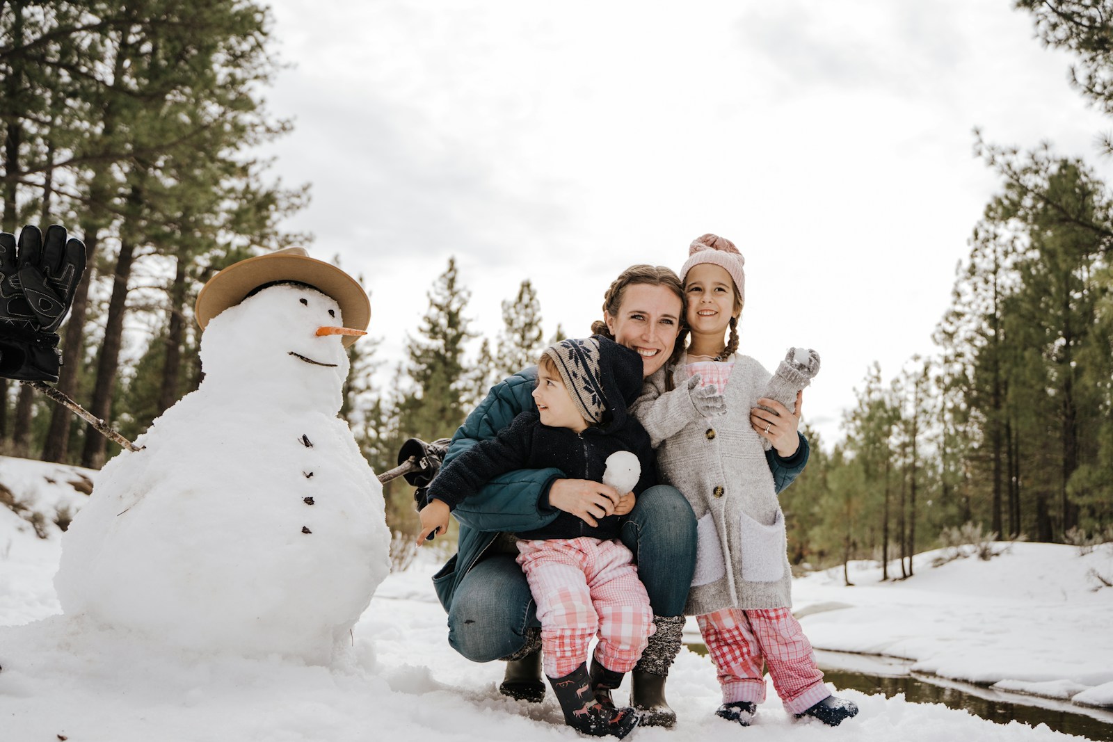 Family enjoying outdoor winter play together
