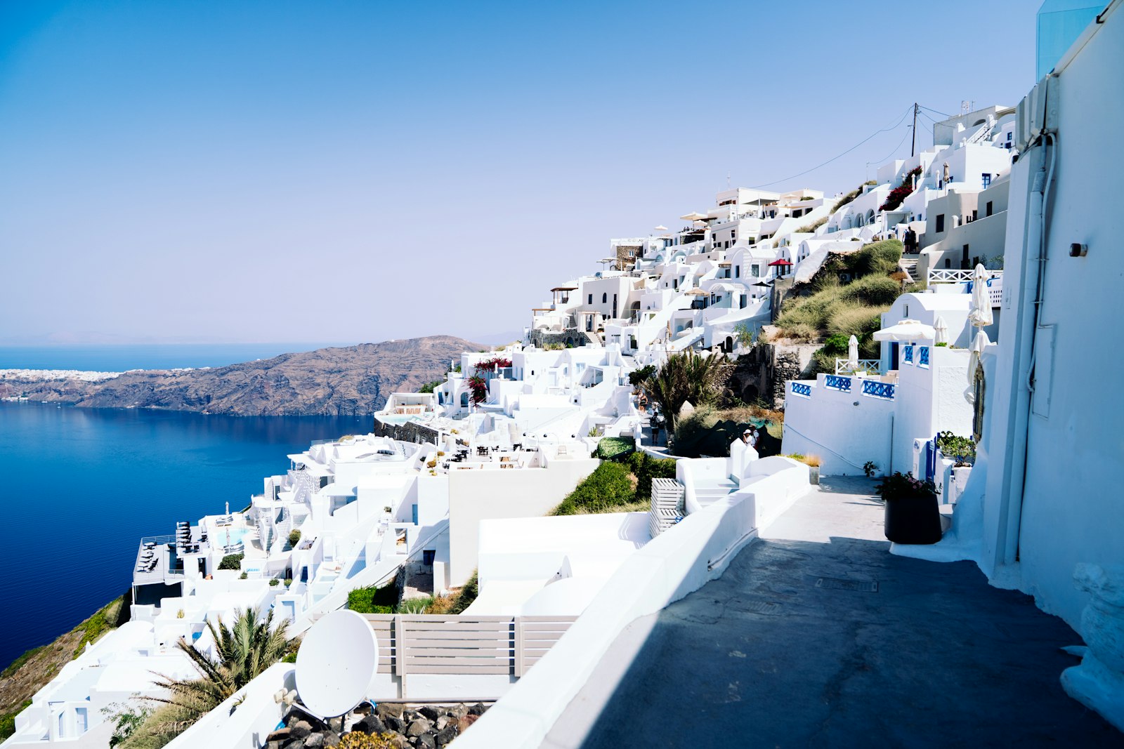 Whitewashed Greek island village overlooking the blue Aegean Sea