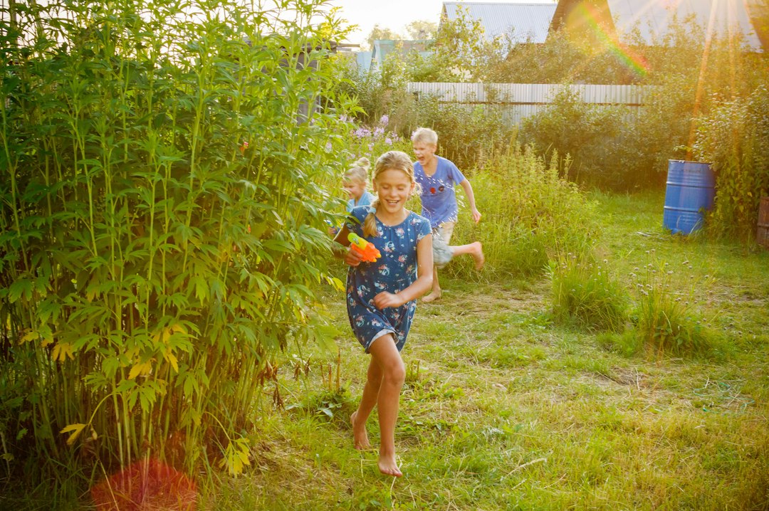 Children playing an energetic water game outdoors