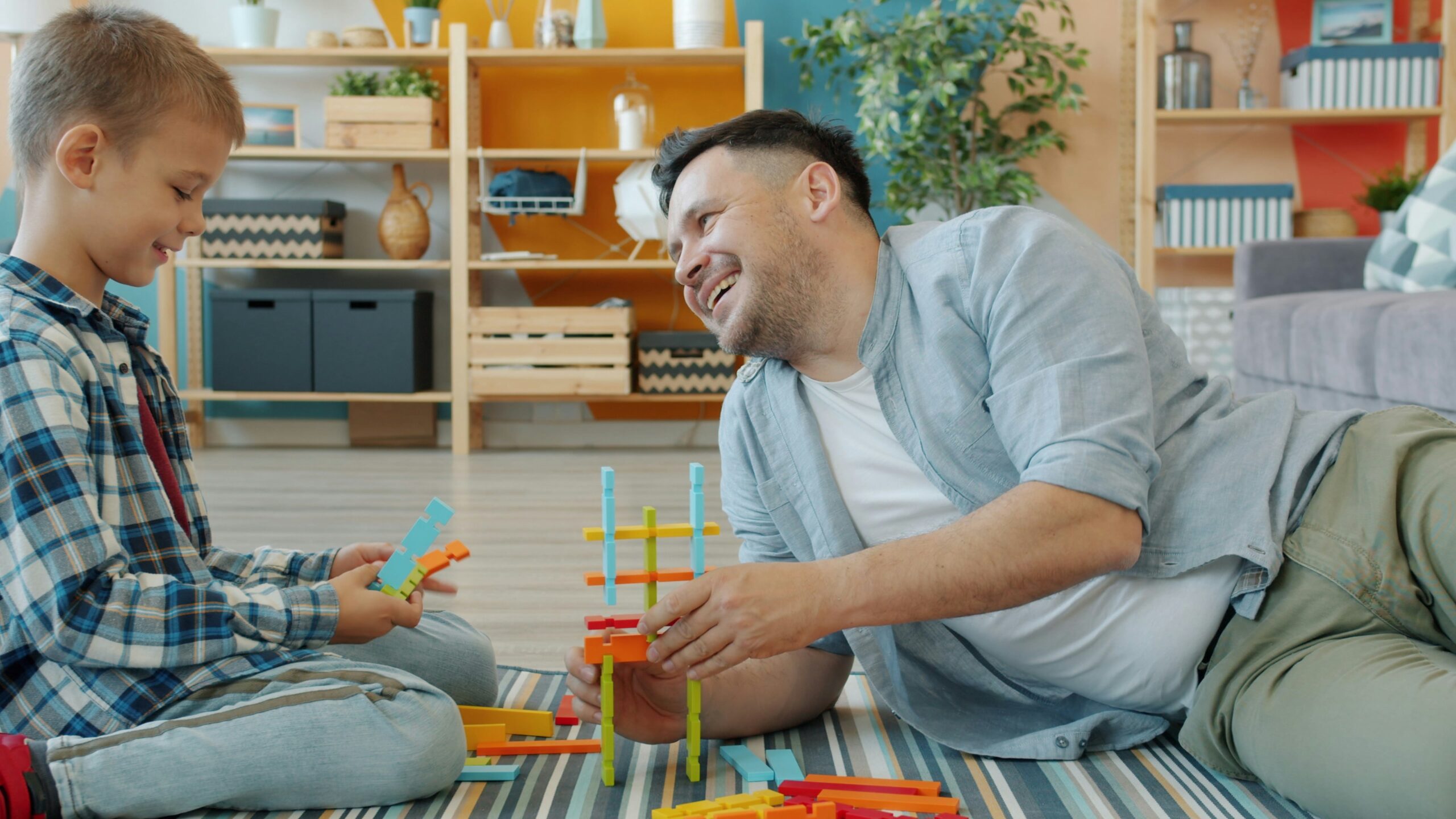 Parent and child exploring a hands-on learning activity at home