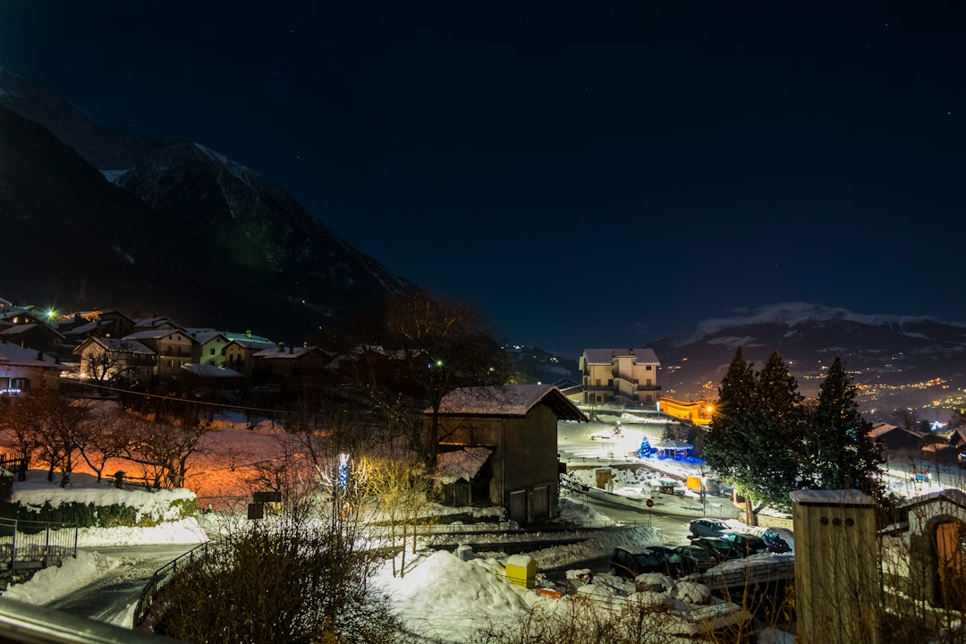 Winter view of a town beneath mountains in Italy’s Aosta Valley
