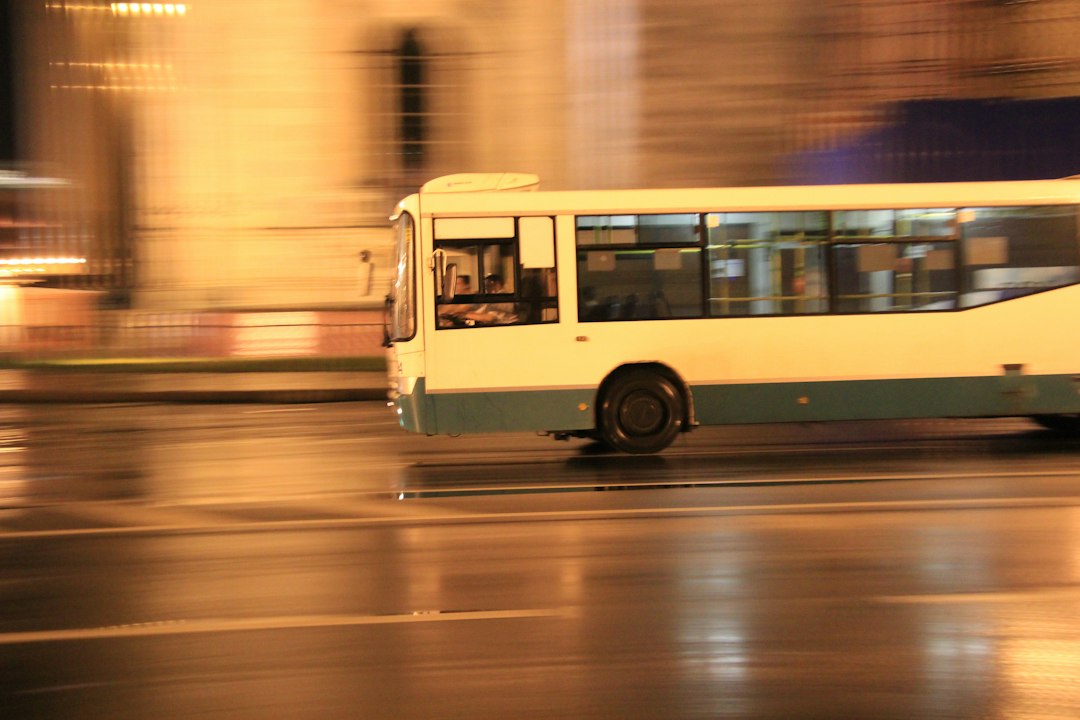 City bus in urban traffic, illustrating the need to check local public transport conditions when travelling with a stroller