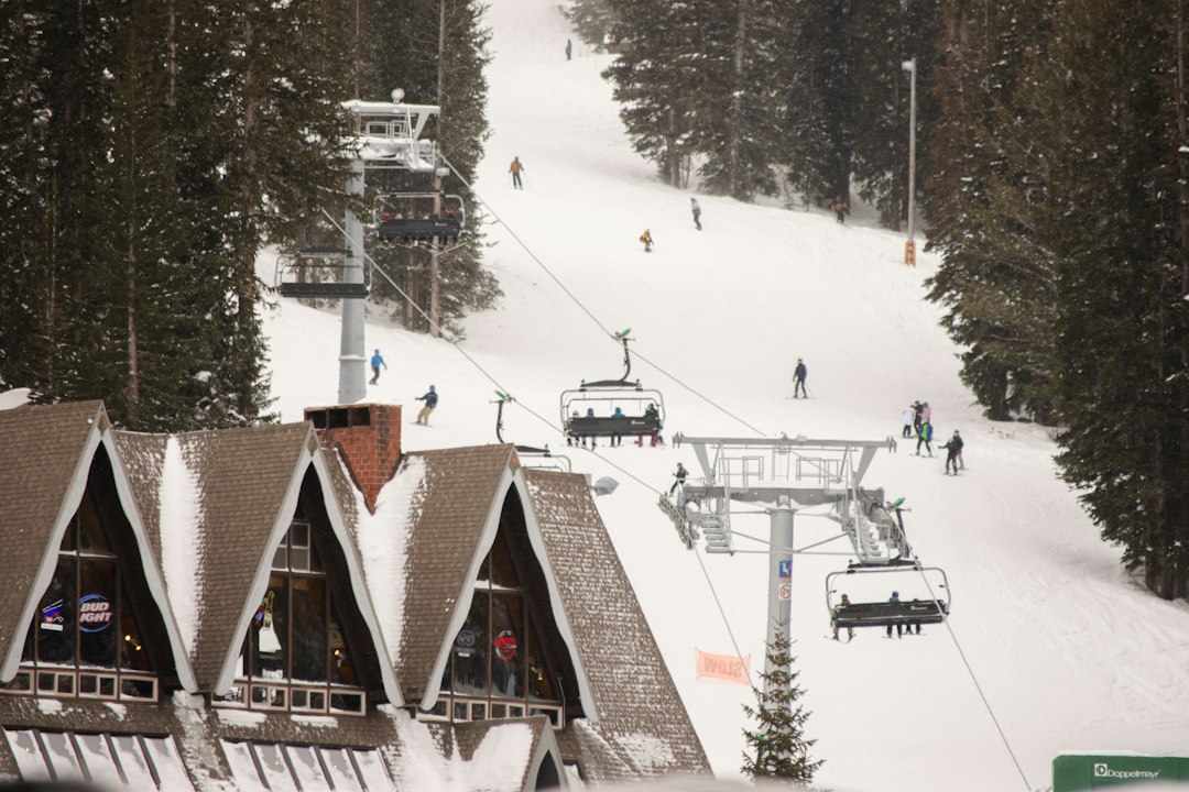 A ski lift ascending a snowy mountain in Utah