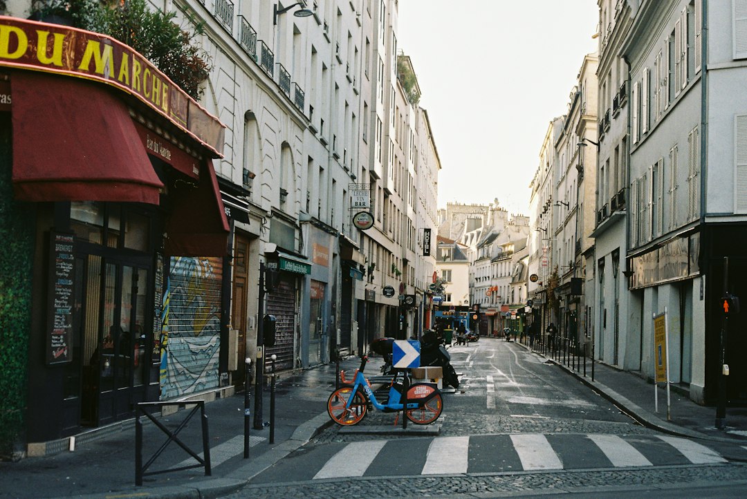 Narrow European city street with historic buildings