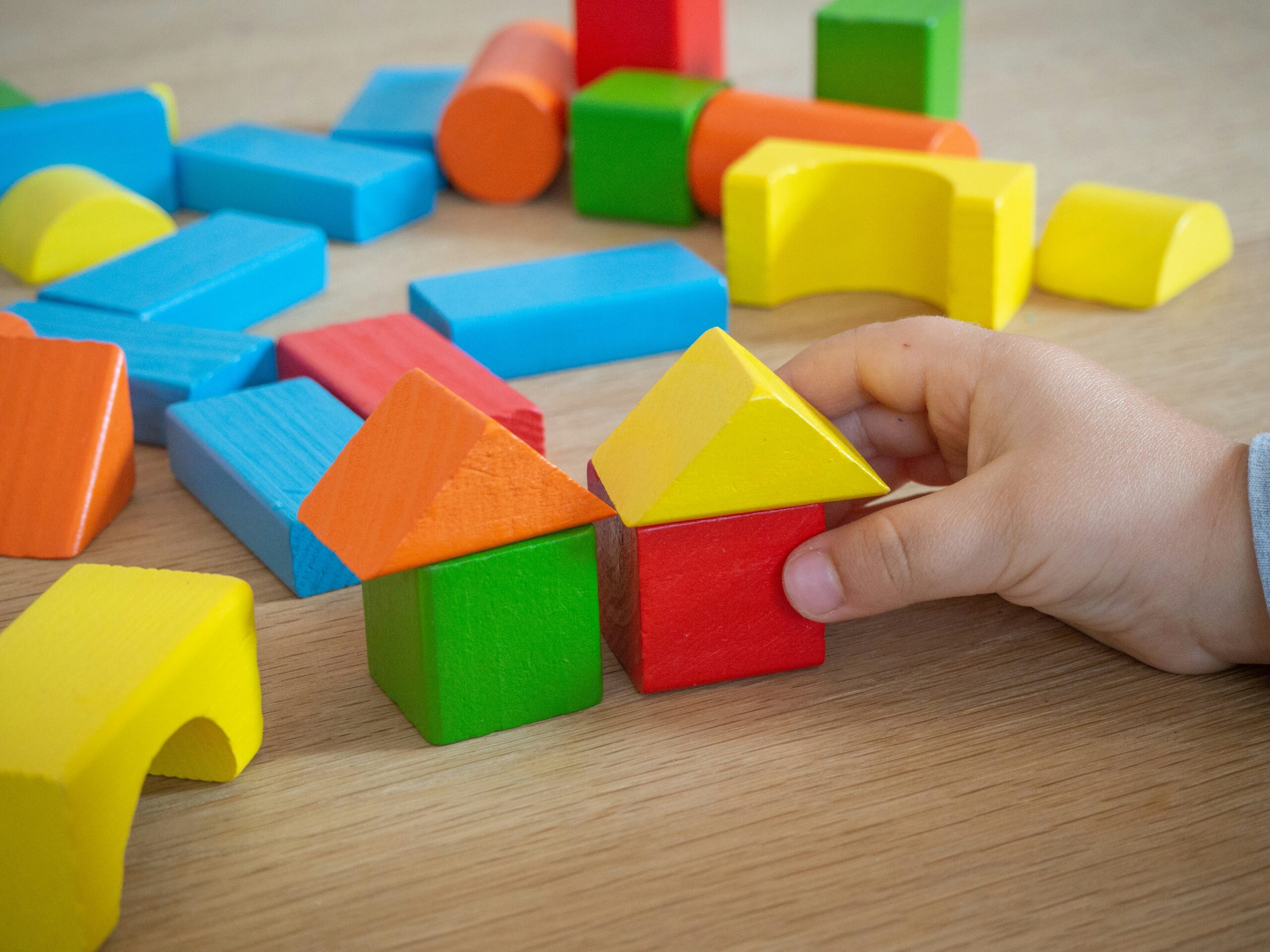 Wooden blocks arranged for a preschool pattern and concentration game